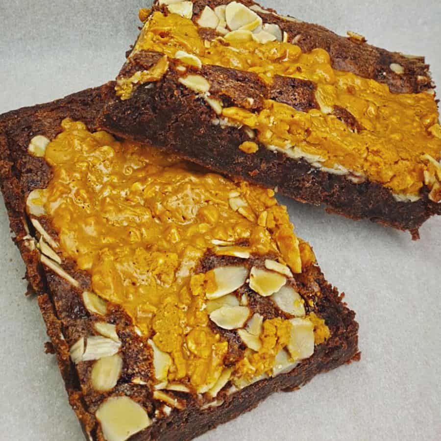 Picture of a Belgian chocolate brownie drizzled in caramel and sprinkled with peanuts, an all time favourite.
